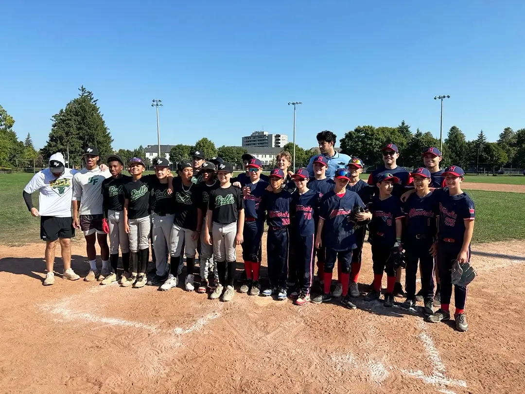 Midtown_Monarchs_team_group_photo_T Midtown Monarchs baseball team group photo, with players smiling at the camera