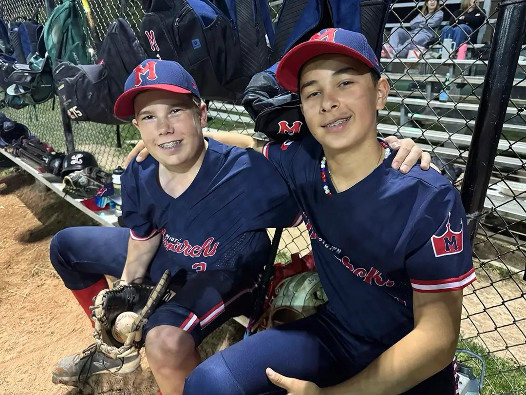 Midtown_Monarchs_two_teammates_T Two happy Midtown Monarchs players smiling at the camera